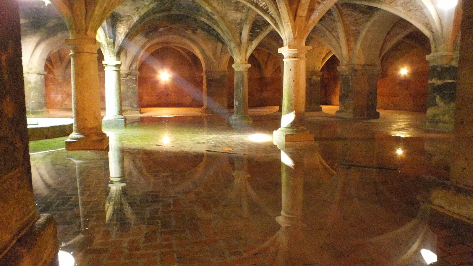 The vaulted Portuguese Cistern of El Jadida, reflected in a thin layer of water