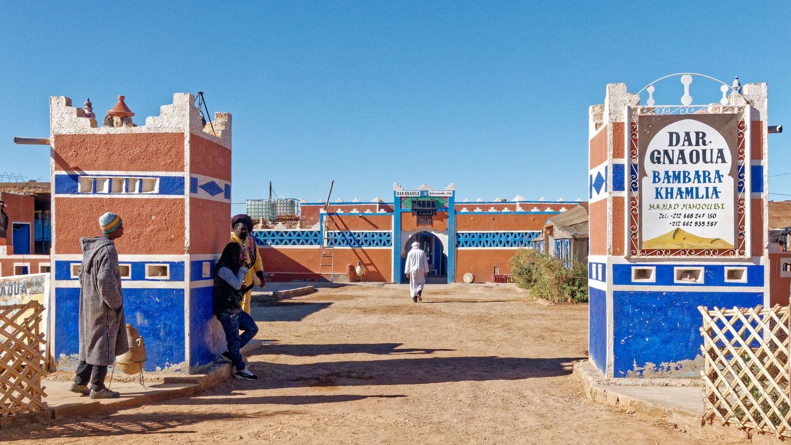 The painted blue and red entrance of the Gnawa music house in Khamlia