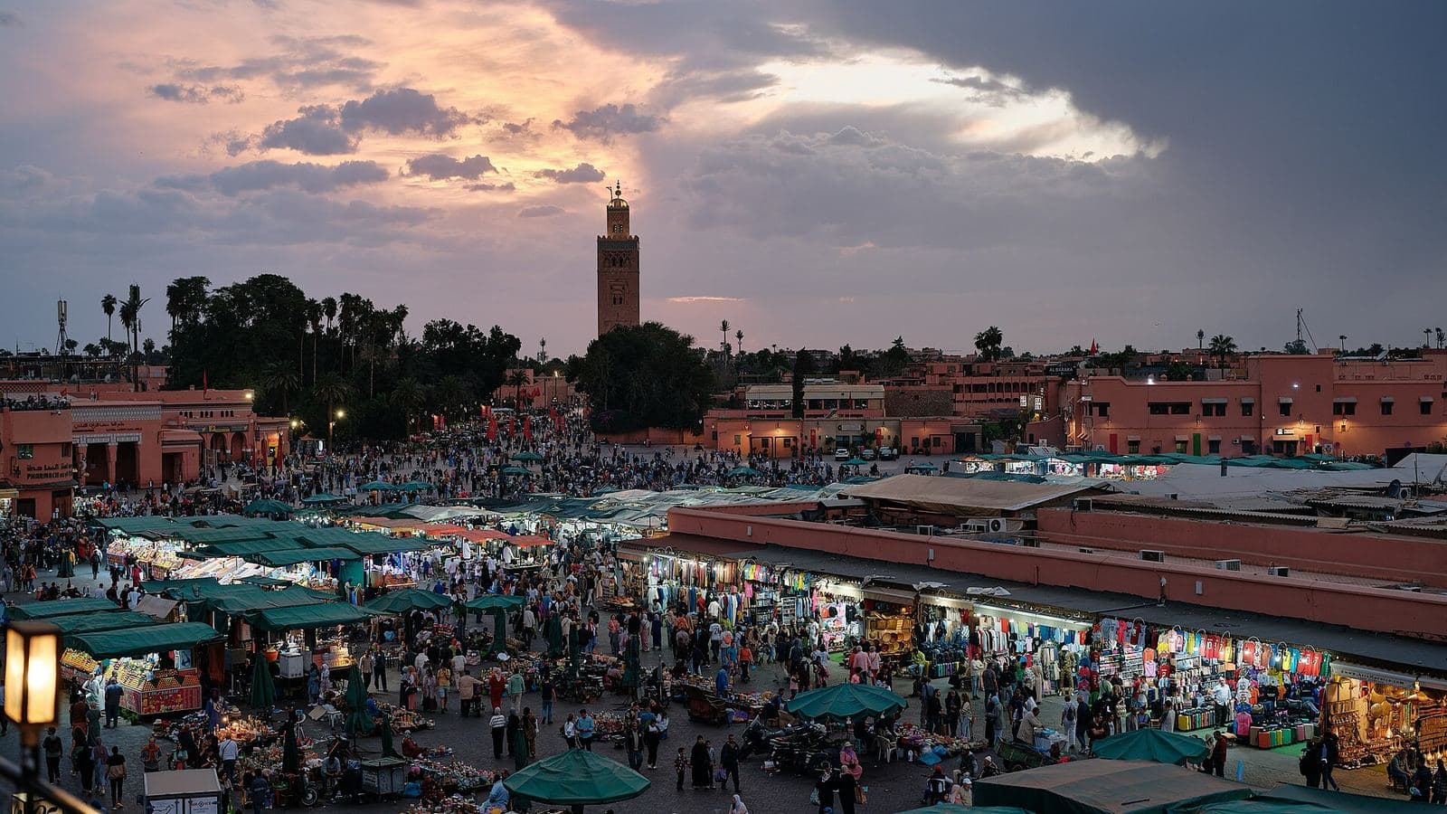 Jemaa el-Fnaa square at sunset with the Koutoubia minaret behind