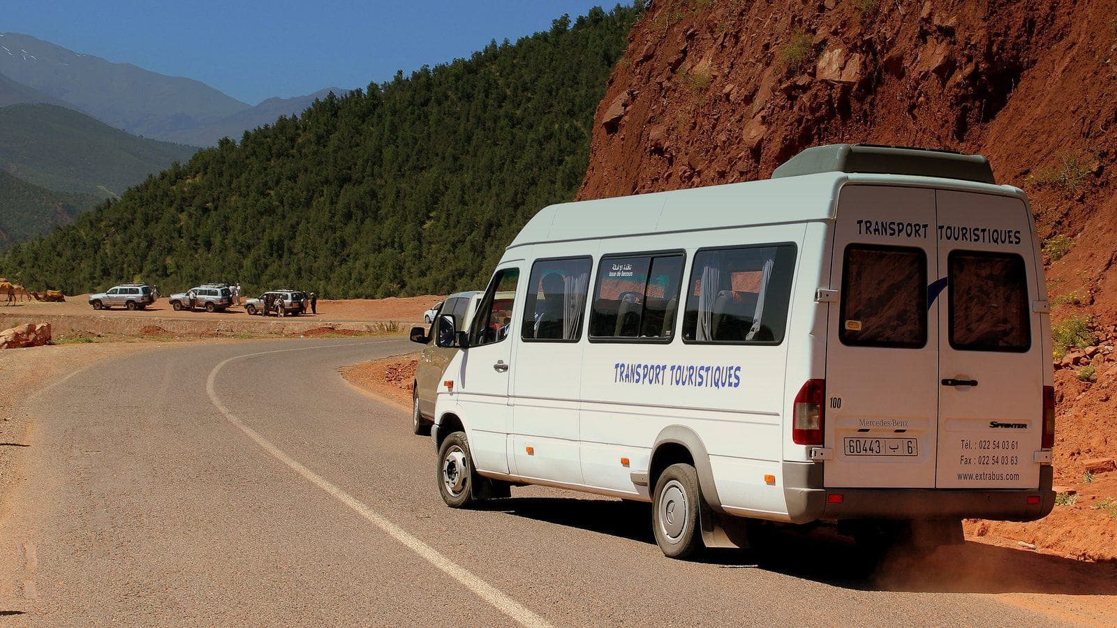 White tourist minibus on a mountain road in Morocco