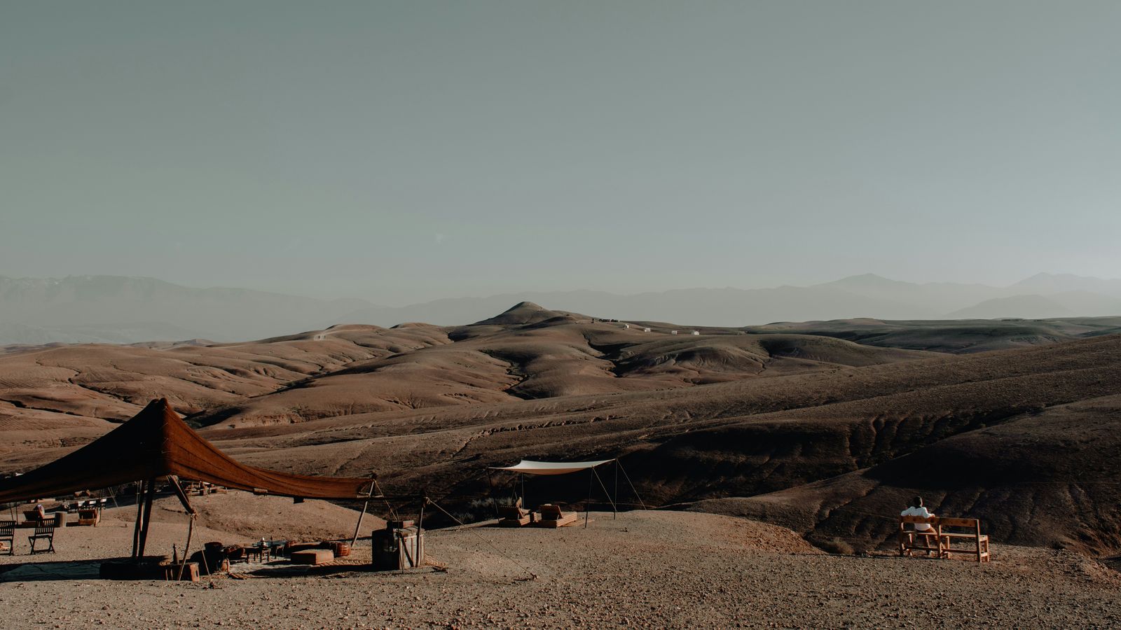 A Berber tent pitched on the stony plain of the Agafay desert